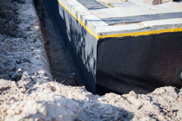 Professional Basement Waterproofing technician working in Jamestown, OH